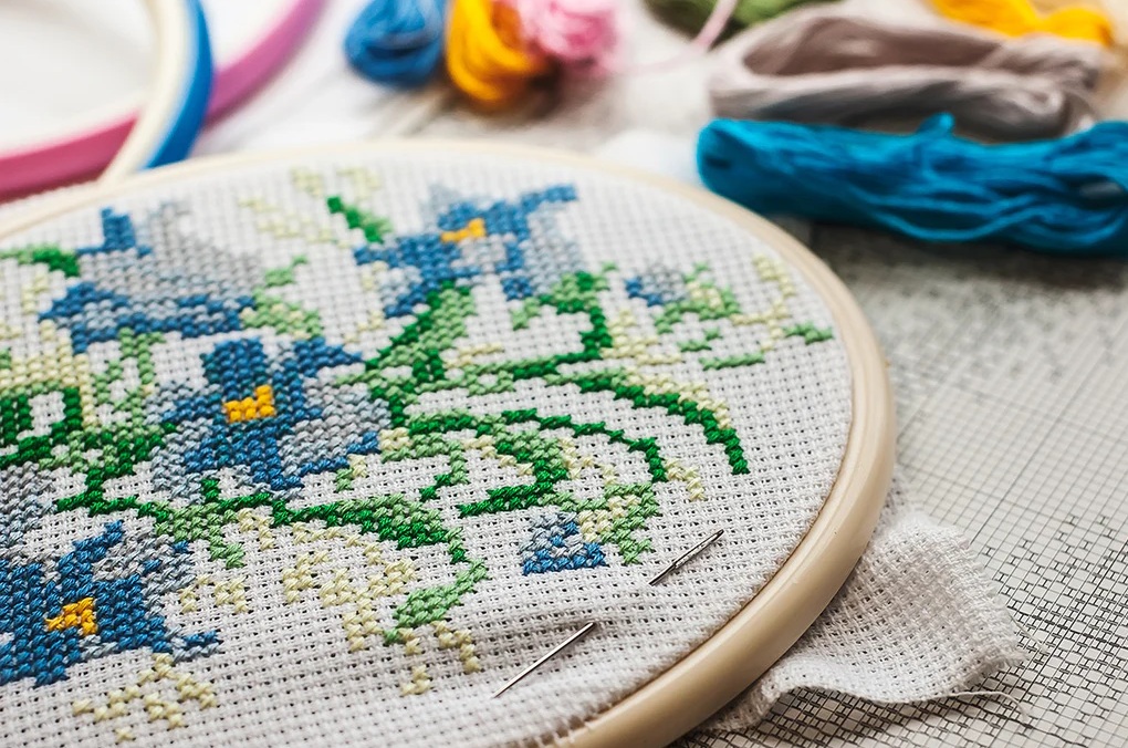 Close-up of cross-stitch process